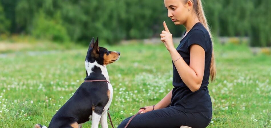young woman training her dog